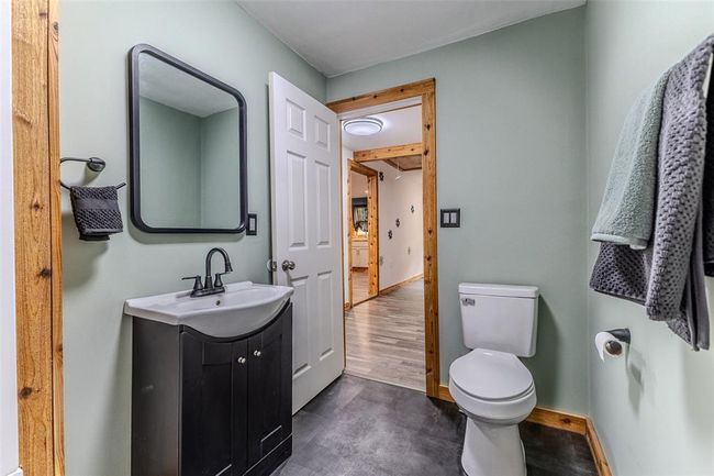 Bathroom with vanity, toilet, and baseboards | Image 37