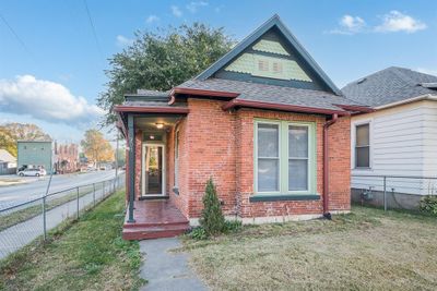 View of front of home featuring a front yard | Image 1