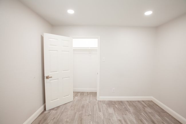 Unfurnished bedroom featuring light wood-style floors, recessed lighting, a closet, and a spacious closet | Image 37