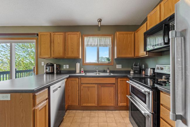 908 24th Ave NW - stainless appliances and plenty of counter and cupboard space; dishwasher is new in 2022 | Image 9