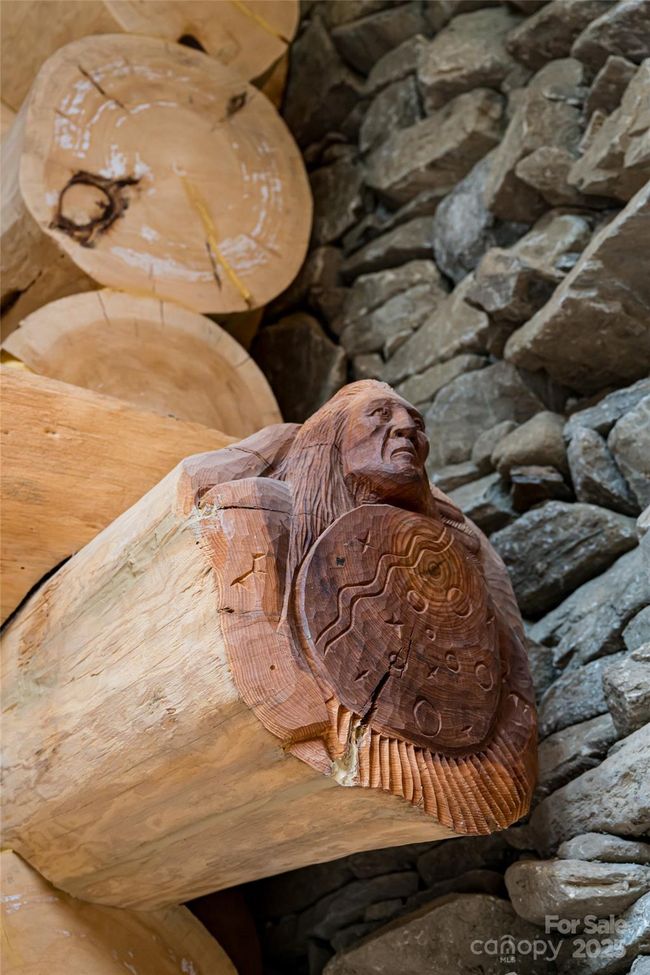 Artist Paul Hornbuckle carved two custom pieces directly into the log onsite during construction! | Image 18