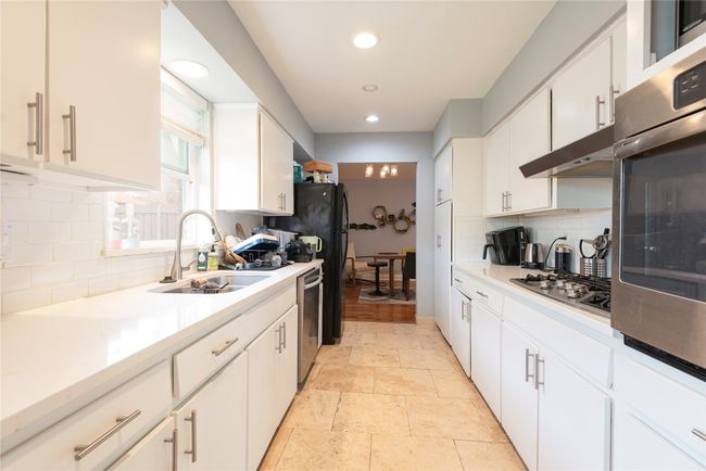 Plenty of cabinets in this white kitchen!! | Image 36