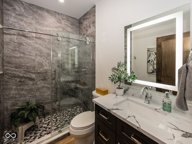 bathroom with vanity, a stall shower, toilet, and recessed lighting | Image 27
