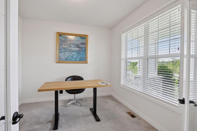 Main floor flex room currently being used as an office | Image 6