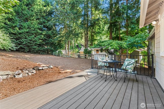 back deck off of the kitchen with newer composite decking | Image 27