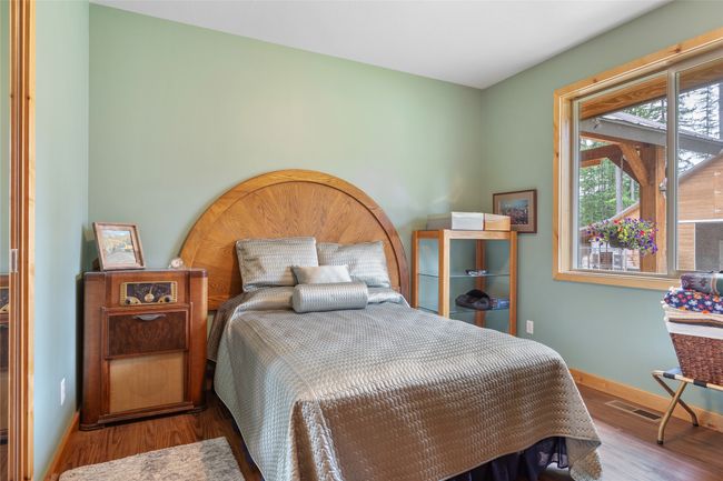 Bedroom featuring baseboards and wood finished floors | Image 49