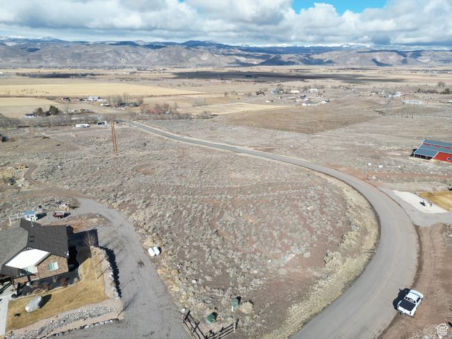 View of rural area featuring a mountainous background and a desert landscape | Image 10