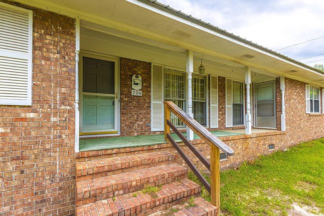 Entrance to property featuring a porch | Image 4