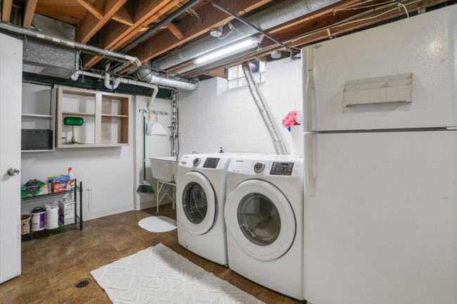 Laundry area with extra fridge and storage | Image 18