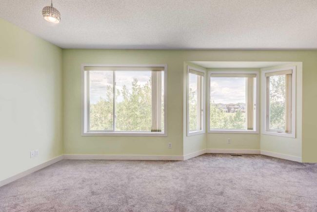 420 Rocky Ridge Cove Nw, Home with 3 bedrooms, 3 bathrooms and 4 parking in Calgary AB | Image 22