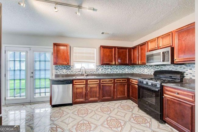 1909 Sawgrass Dr, House other with 5 bedrooms, 3 bathrooms and 2 parking in Hampton GA | Image 9