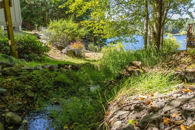 Creek beside the house can be heard from the bedroom window | Image 45