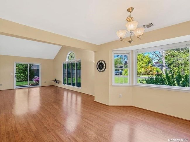 Bright Open Living Room/Dining with vaulted ceiling | Image 6