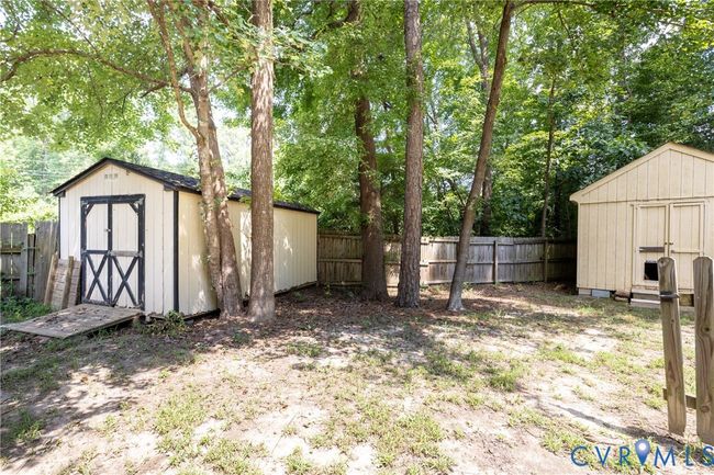 Fenced backyard with a shed | Image 48