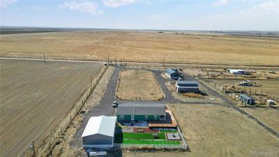 View to the south and 112th Ave- house, detached garage, pole barn, metal workshop, shed and animal shelter | Image 2