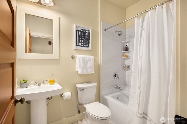 Hall bathroom includes new tub/shower and new toilet. | Image 20