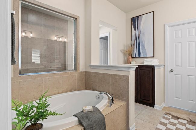 Full bathroom featuring a bath and tile patterned flooring | Image 23