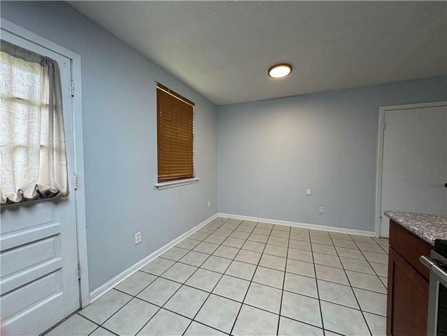 Looking to the back door and the dining area | Image 8