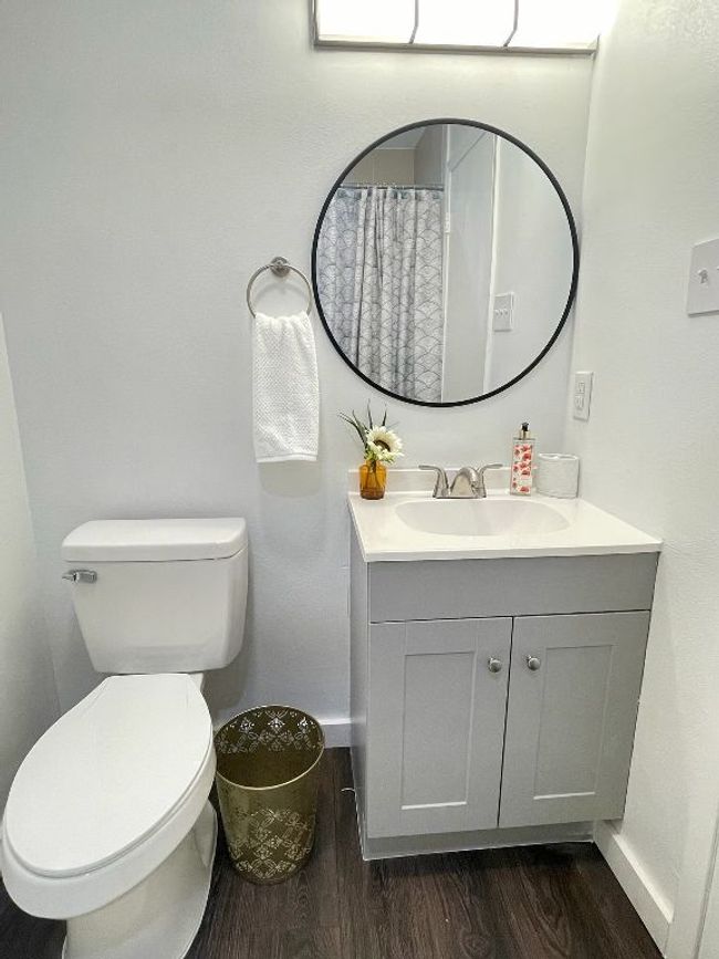 Bathroom with vanity and wood finished floors | Image 10
