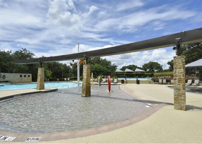 View of community with a swimming pool and a patio | Image 35