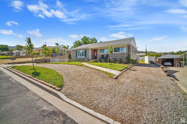 View of front of home with gravel driveway | Image 36