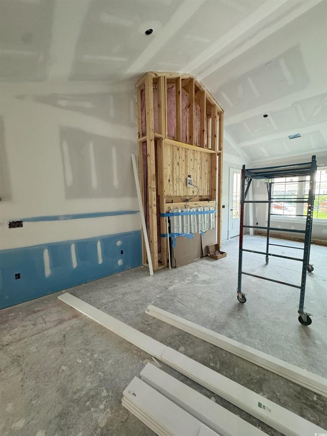 Misc room with lofted ceiling and a garage | Image 31