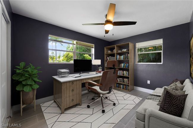 Office space featuring light tile patterned flooring and ceiling fan | Image 33