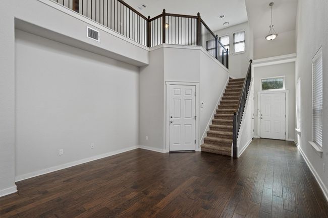 Foyer with a high ceiling, stairway, and dark wood-type flooring | Image 10