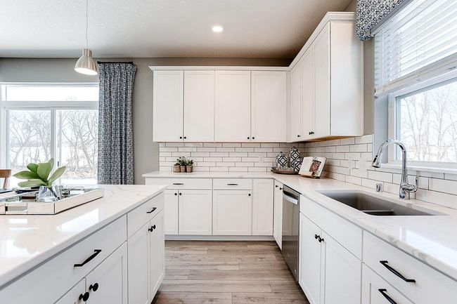 Thoughtfully-designed with a combination of functionality & modern design, this kitchen space is sure to impress. Photo of model home, color & options may vary. | Image 4