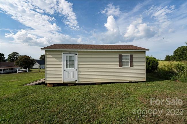 Side of shed with access door. | Image 12