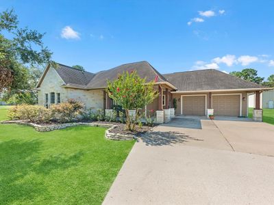 Over-sized 2-car garage, an inviting front porch entry, and beautiful stone elevation | Image 3