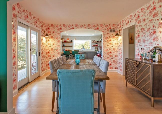 Dining area with light hardwood / wood-style floors and sink | Image 8
