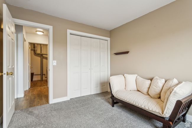 Sitting room featuring carpet flooring and baseboards | Image 11