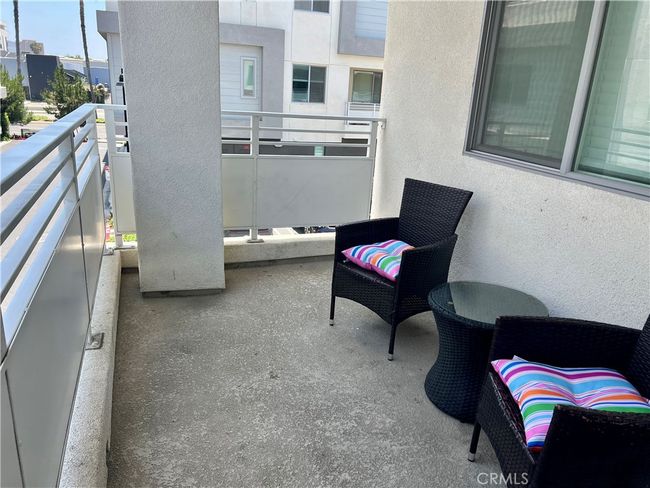The covered balcony outside the living room and dining room. | Image 9