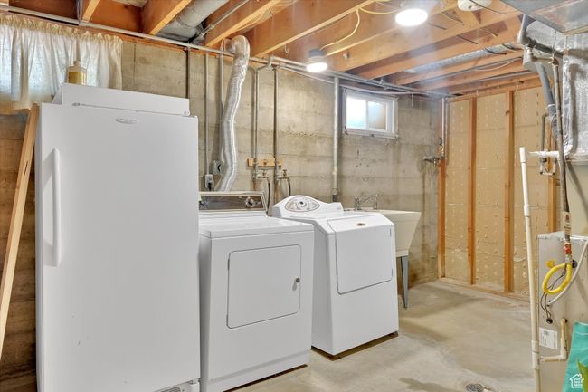 Washroom featuring washer and clothes dryer | Image 21