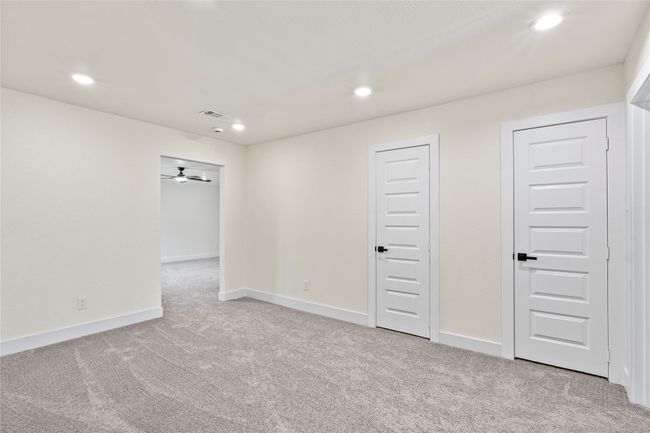 Basement featuring light carpet, recessed lighting, and ceiling fan | Image 15