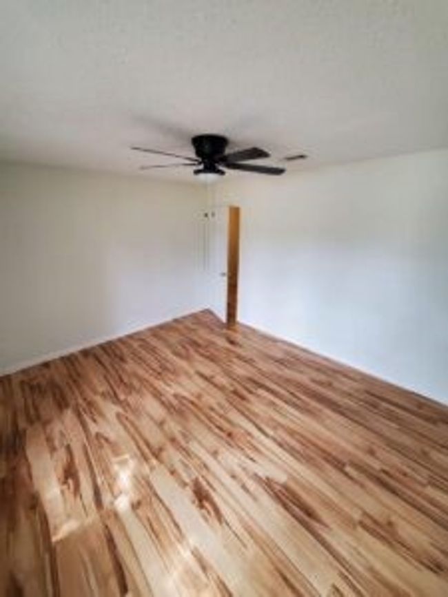 Spare room with wood finished floors and ceiling fan | Image 28