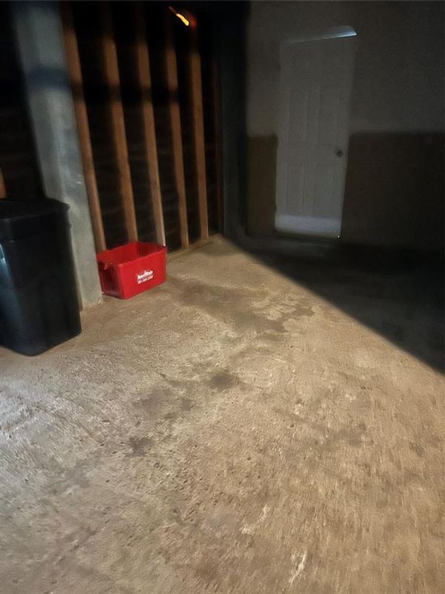 One car garage and door to efficiency bathroom | Image 6