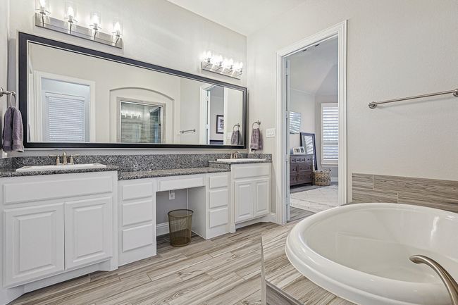 Primary Bath offers luxurious elements like soaking tub, dual sinks, walk in shower and loads of storage! | Image 16