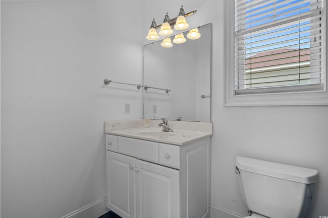 Bathroom featuring vanity and toilet | Image 33