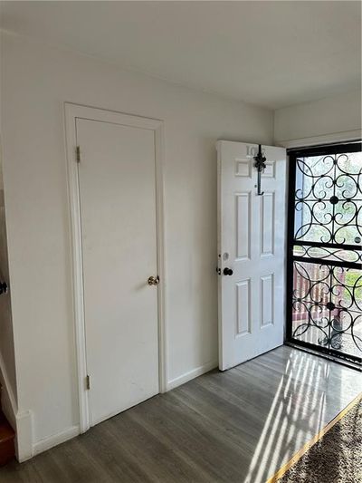 Foyer entrance with dark hardwood / wood-style floors | Image 3