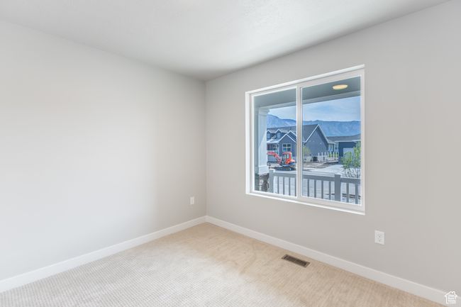 Unfurnished room featuring carpet and baseboards | Image 16