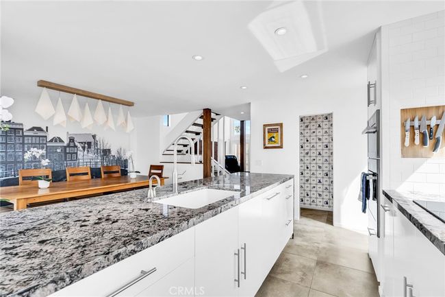 Sleek kitchen counter with built-in dishwasher | Image 8