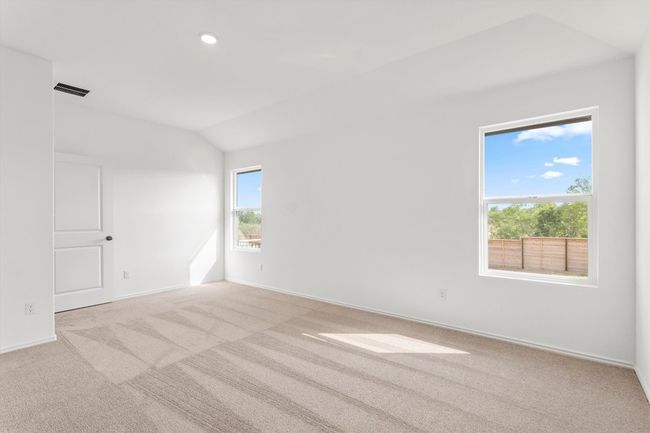 Carpeted spare room with lofted ceiling and recessed lighting | Image 14