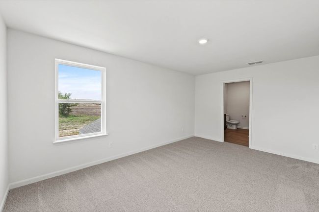 Carpeted empty room featuring baseboards | Image 6