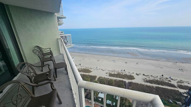 Balcony with a view of the beach and a water view | Image 29