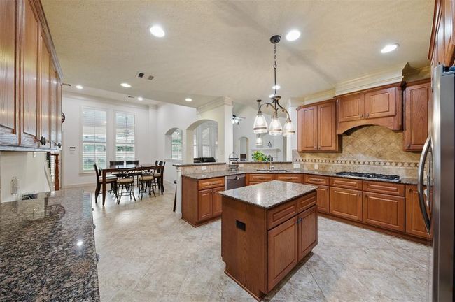 Kitchen overlooks the breakfast room and living room. | Image 23