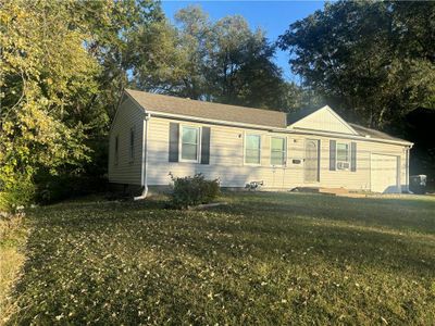 View of front of home with a front lawn and a garage | Image 2