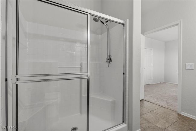Full bathroom with a shower stall and tile patterned flooring | Image 34