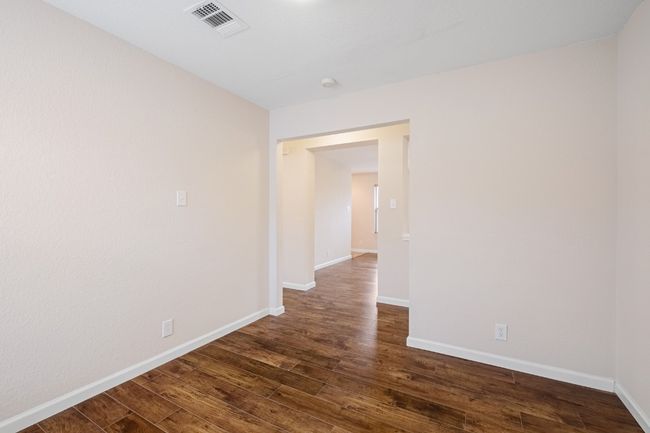 Unfurnished room featuring dark wood-type flooring | Image 18